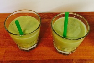 Finished Avocado Orange Shake in glasses with straws